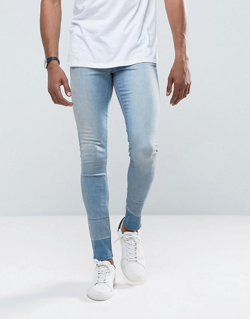 Lyst Asos Extreme Super Skinny Jeans In Light Wash With Hem Detail In