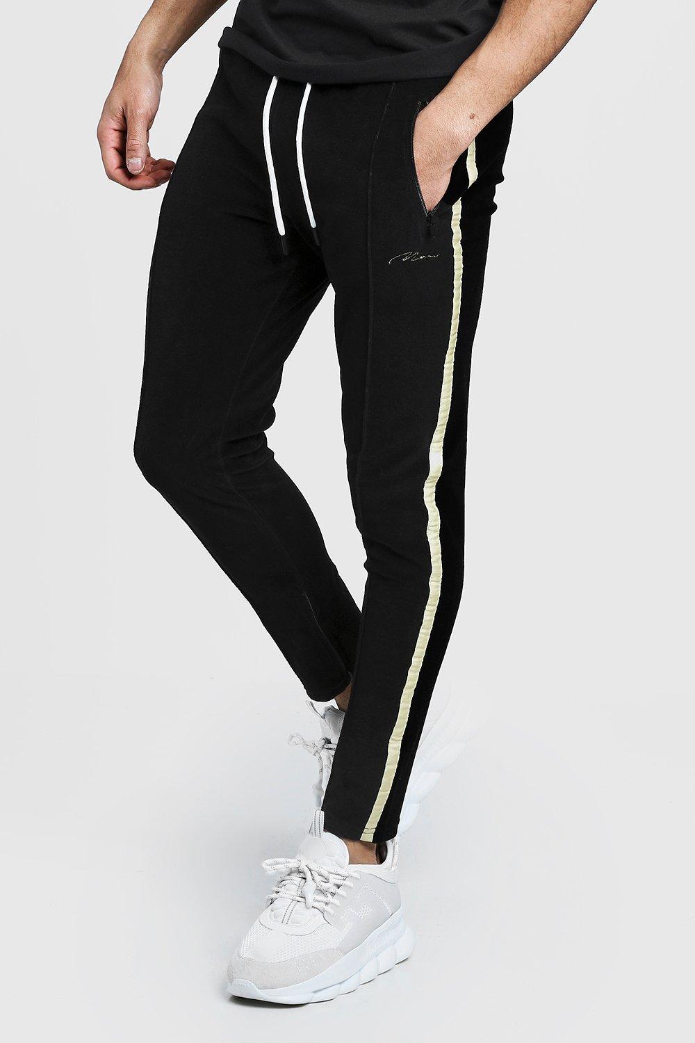 BoohooMAN Velours Jogginghose Mit Man schriftzug Und Eng zulaufende Jogginghose aus Webmaterial mit Sport Slogan | Boohoo