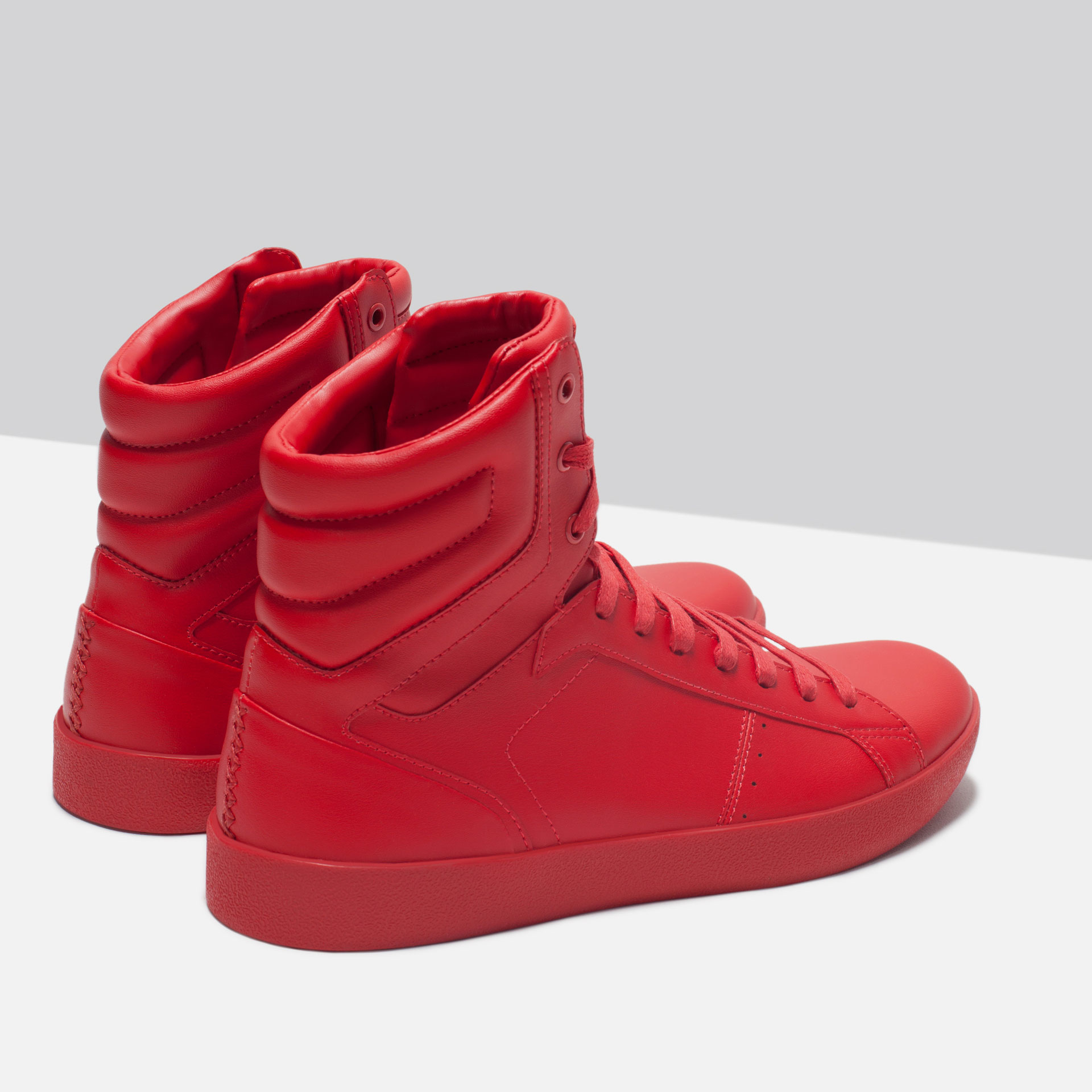 red and white adidas high tops