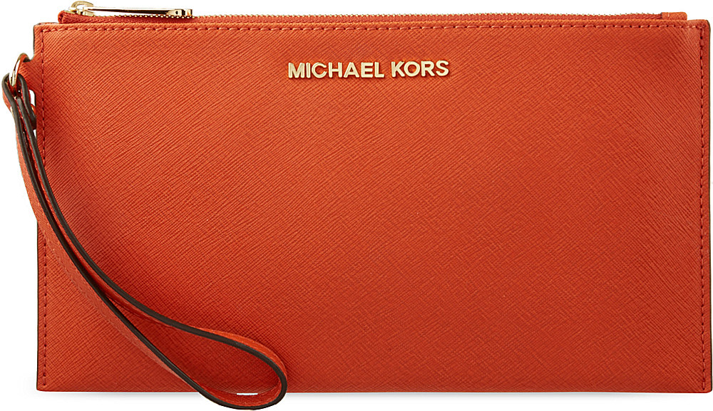 Michael Kors Leather Travel Clutch Bag In Orange Lyst Gallery