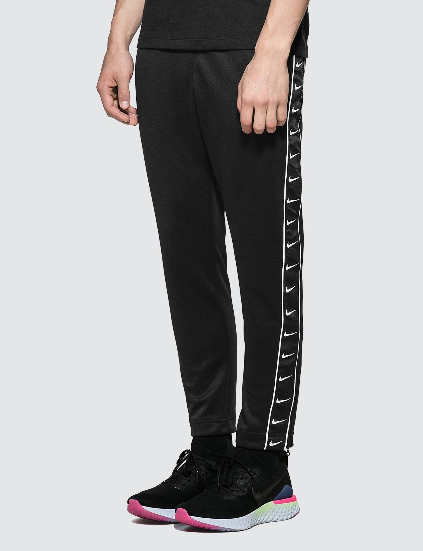 nike solo swoosh track pants