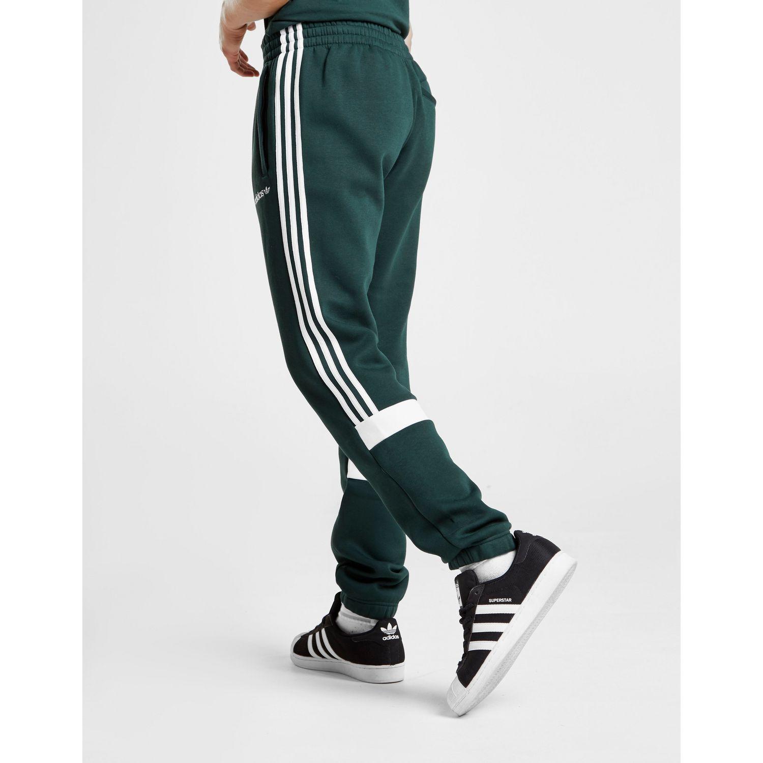green adidas track pants mens