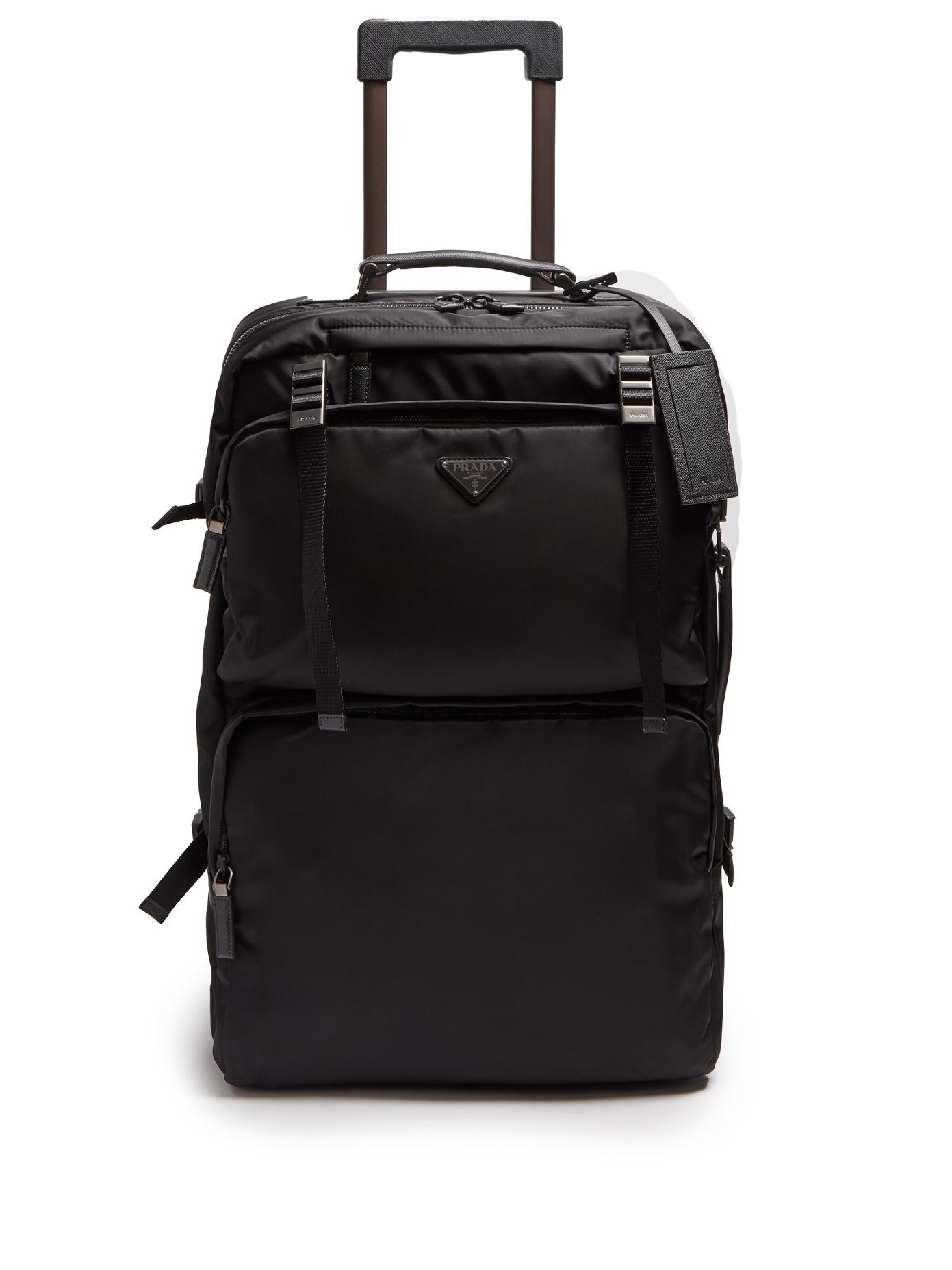 lyst - prada multi-pocket nylon and leather suitcase in black
