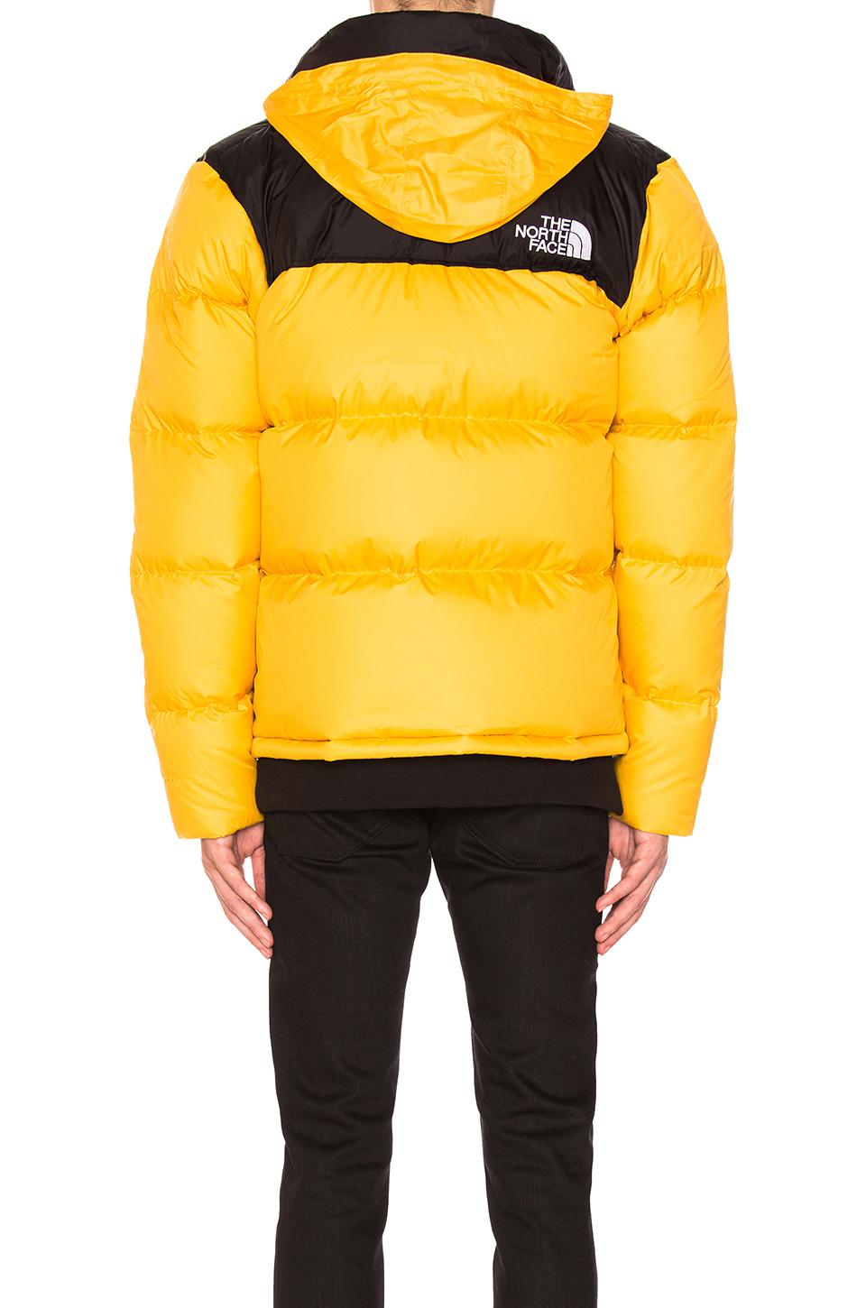 yellow north face jacket