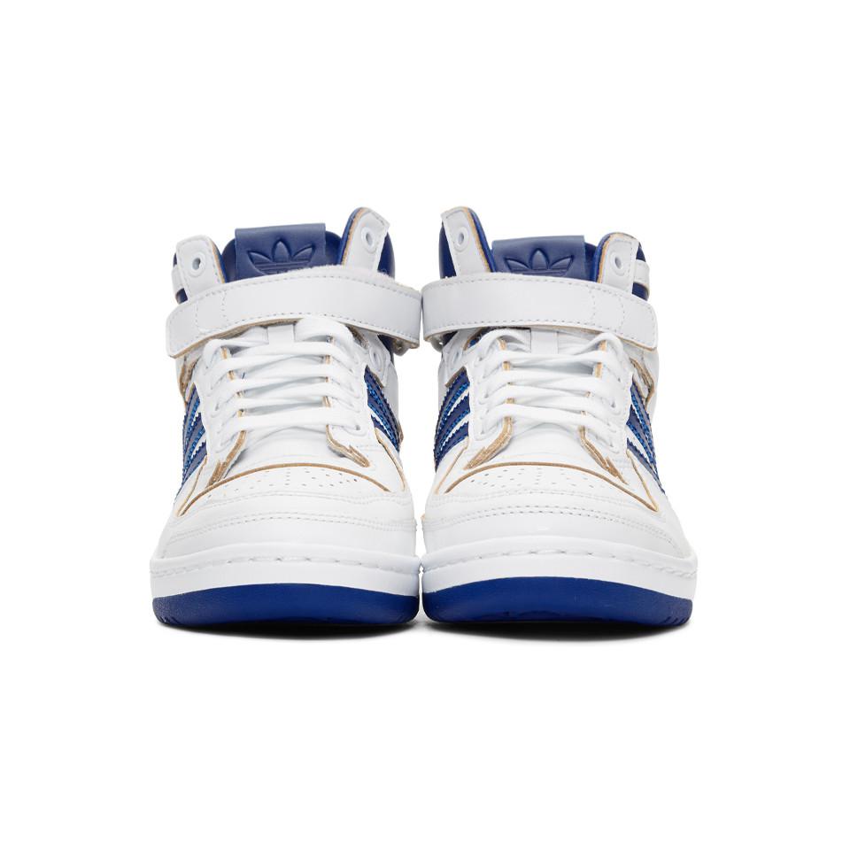 blue and white adidas forum