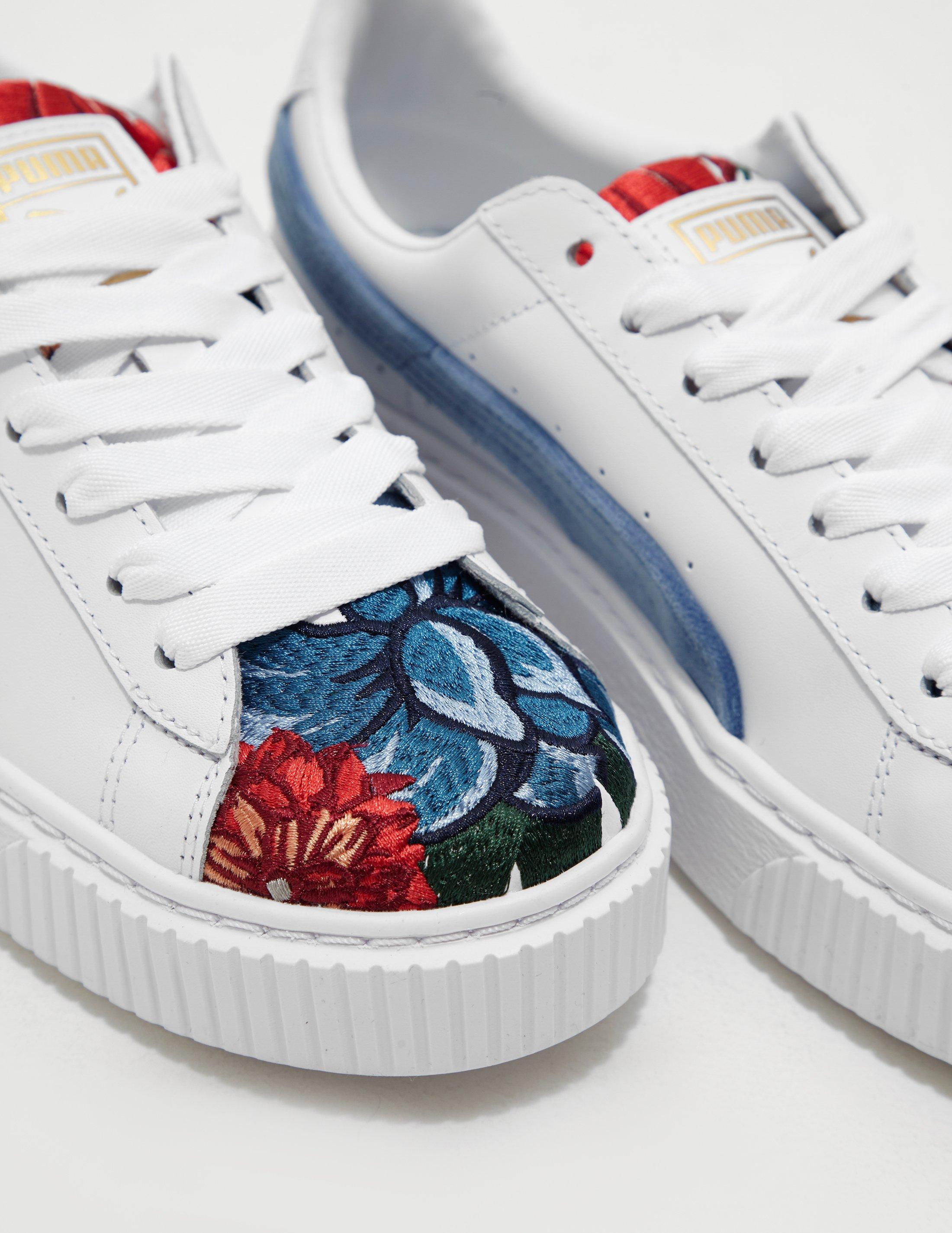 puma suede platforms in white with embrodiery