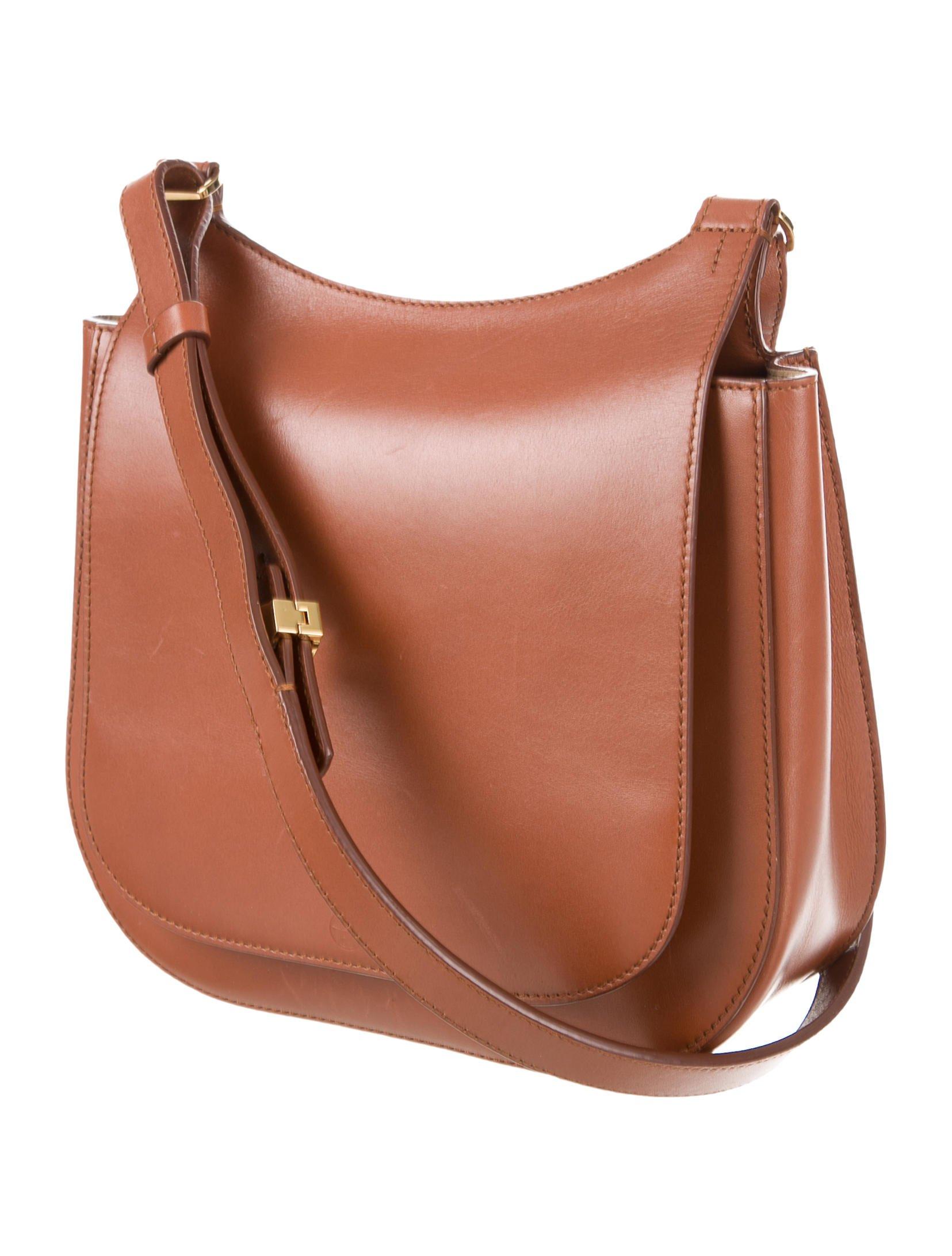 The row Hunting 11 Bag Cognac in Metallic Lyst
