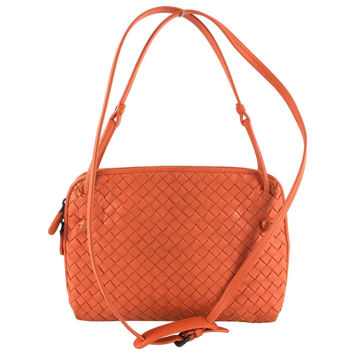 orange leather handbags and purses