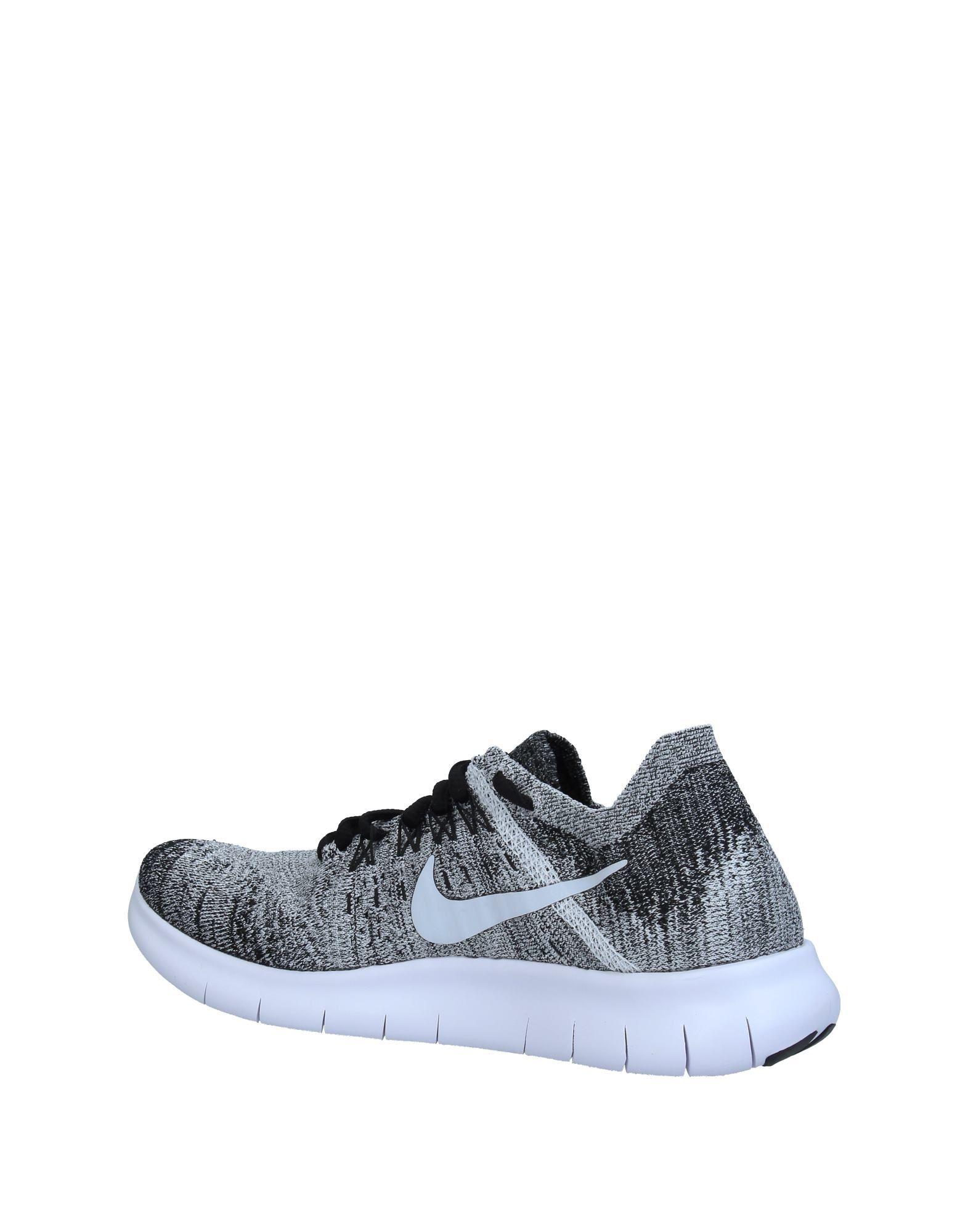 grey low top nikes